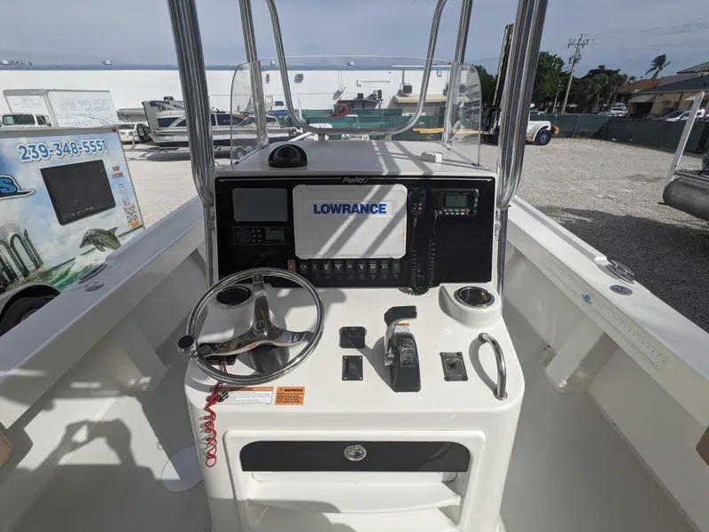 Slide: The Image of 2019 Parker 2500 SE Center Console boat dashboard with Lowrance navigation system. - 11