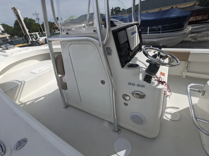 Slide: The Image of 2019 Parker 2500 SE Center Console boat interior with steering wheel and control panel. - 13