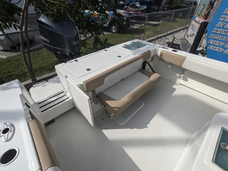 Slide: The Image of 2019 Parker 2500 SE Center Console boat with foldable seating and Yamaha outboard motor. - 4