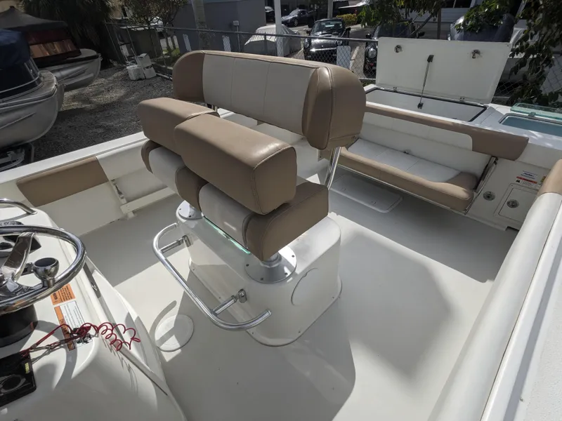 Slide: The Image of 2019 Parker 2500 SE Center Console boat interior with beige seating. - 8