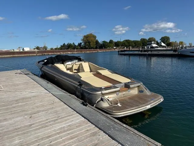Slide: The Image of 2014 Chris-Craft Launch 32 boat with teak deck and beige seating. - 15