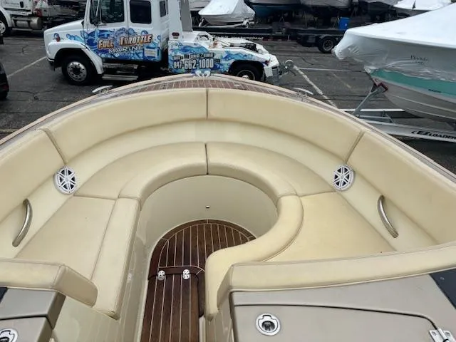 Slide: The Image of 2014 Chris-Craft Launch 32 boat on trailer in parking lot. - 23