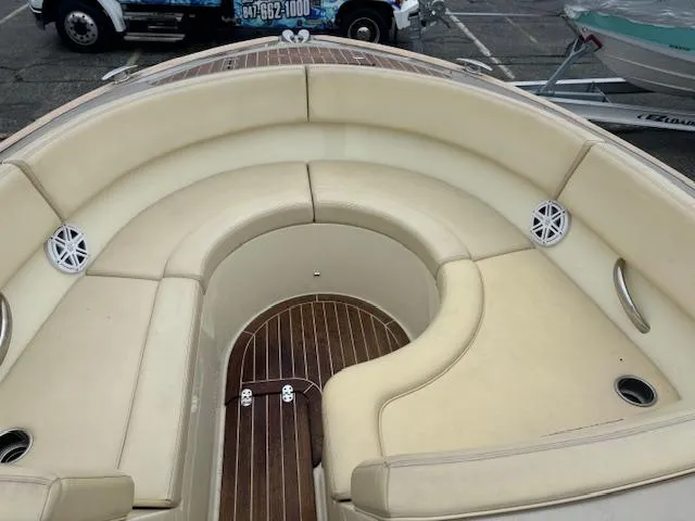 Slide: The Image of 2014 Chris-Craft Launch 32 boat on trailer, rear view with dual propellers. - 24