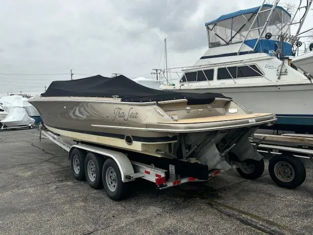 Slide: The Image of 2014 Chris-Craft Launch 32 dashboard with Simrad navigation and wooden steering wheel. - 3