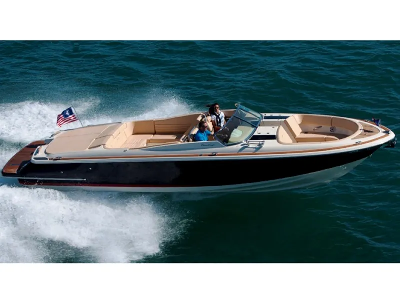 Slide: The Image of 2014 Chris-Craft Launch 32 boat on trailer, covered, parked in marina. - 6