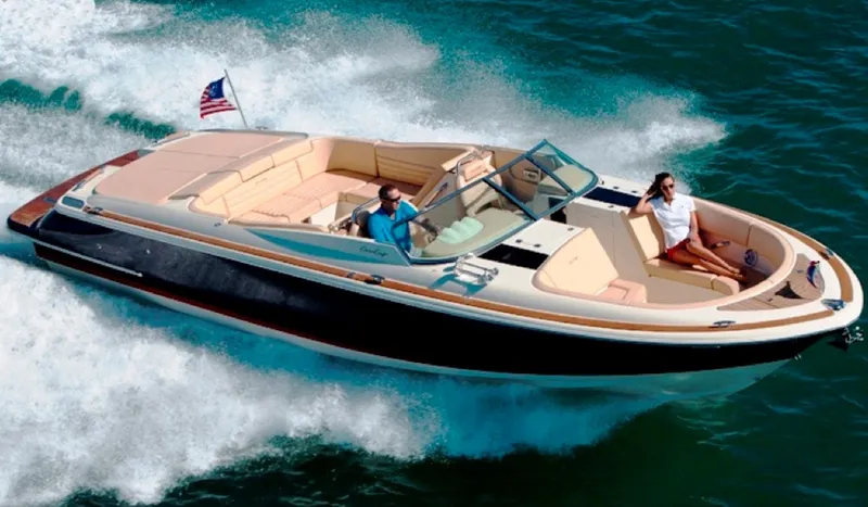 Slide: The Image of 2014 Chris-Craft Launch 32 boat on trailer, covered, parked in marina. - 8