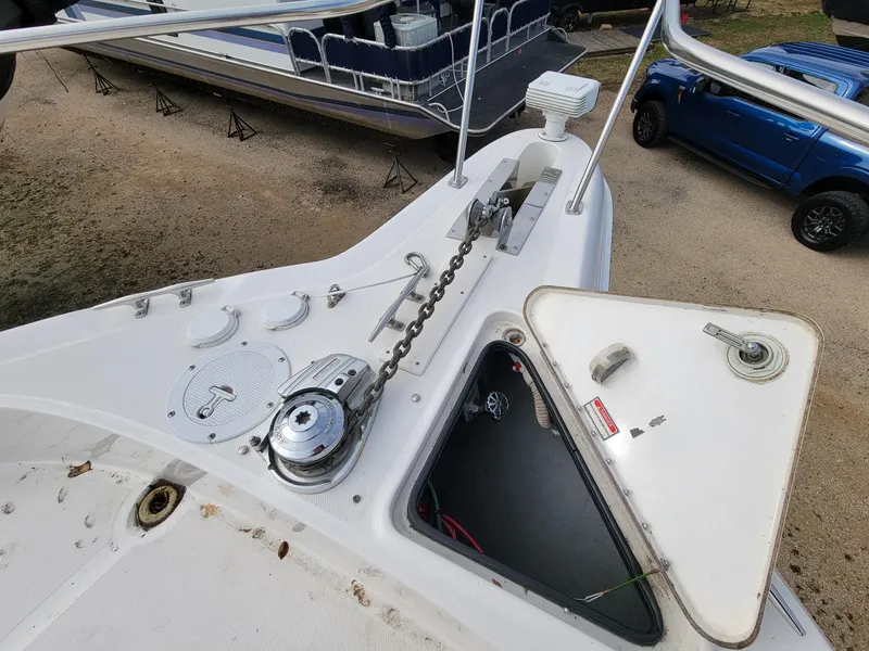 Slide: The Image of 2000 Sea Ray 460 Sundancer boat deck with anchor chain and open hatch. - 14