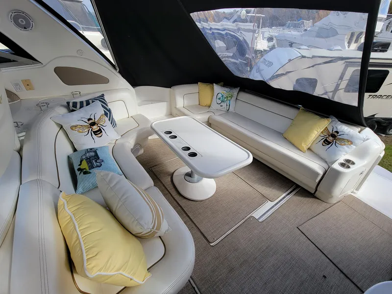 Slide: The Image of Luxurious 2000 Sea Ray 460 Sundancer yacht interior with plush seating and decorative pillows. - 17