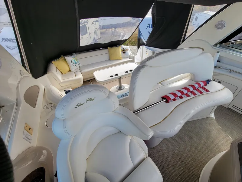 Slide: The Image of Luxurious interior of 2000 Sea Ray 460 Sundancer yacht with white seating and table. - 19