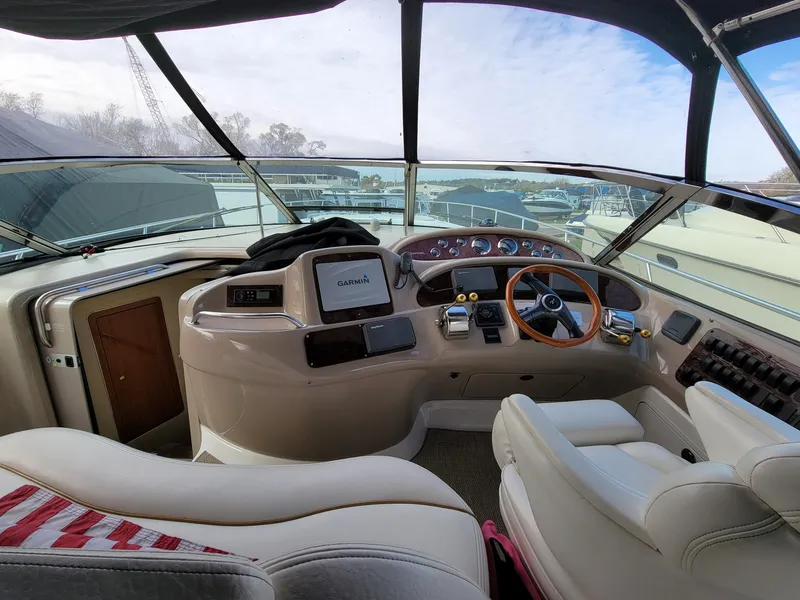 Slide: The Image of Interior view of 2000 Sea Ray 460 Sundancer yacht cockpit with steering wheel and navigation equipment. - 21