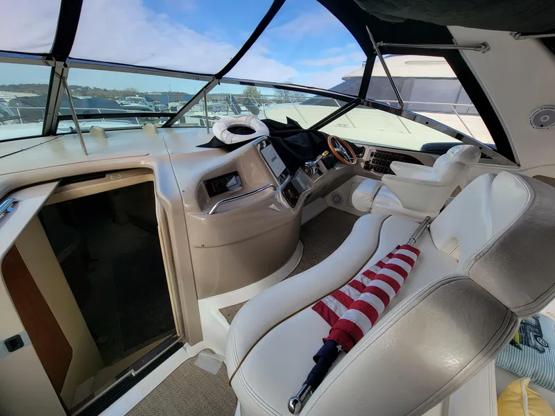 Slide: The Image of Interior of 2000 Sea Ray 460 Sundancer yacht with helm and seating area. - 24