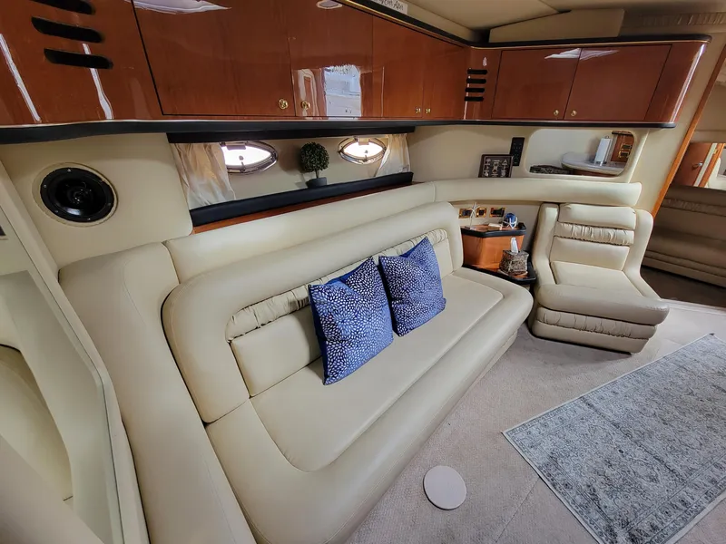 Slide: The Image of Luxurious interior of 2000 Sea Ray 460 Sundancer yacht with beige leather seating. - 32