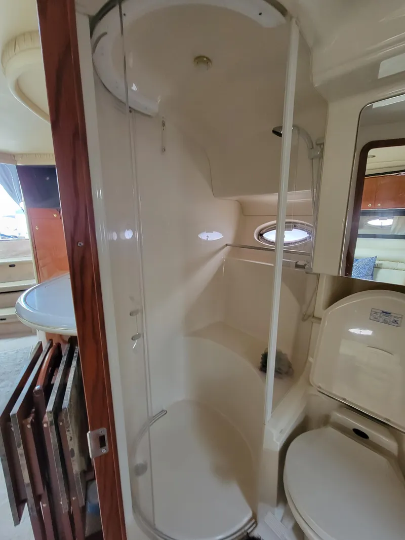 Slide: The Image of 2000 Sea Ray 460 Sundancer bathroom with shower and toilet. - 37
