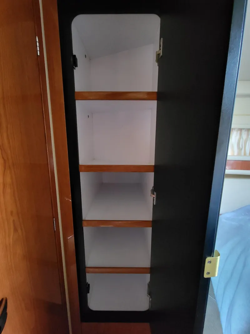 Slide: The Image of Empty wooden cabinet inside 2000 Sea Ray 460 Sundancer yacht. - 41