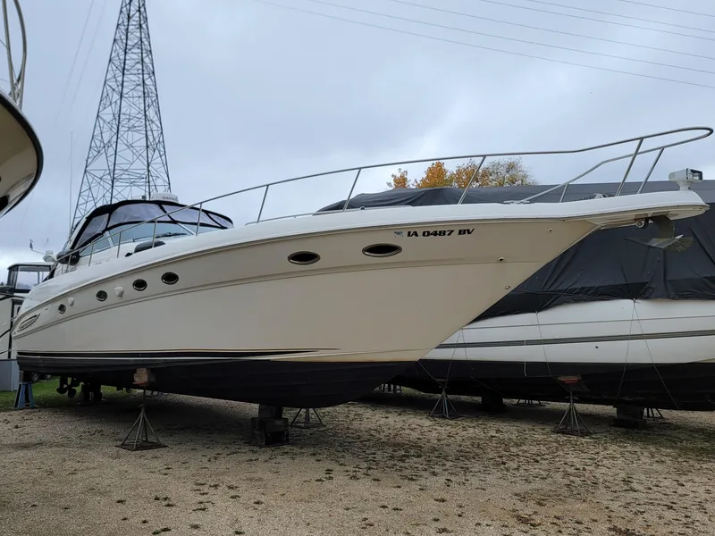 Slide: The Image of 2000 Sea Ray 460 Sundancer yacht on land, ready for maintenance. - 7