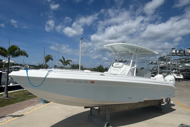 The Image of 2021 Glasstream 280 Pro-XS boat docked under a clear blue sky. - 0