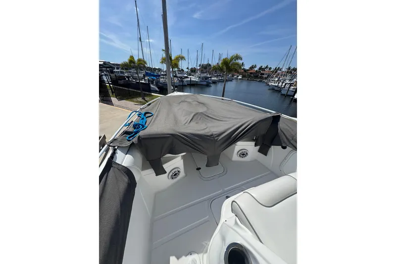 Slide: The Image of 2021 Glasstream 280 Pro-XS boat docked at marina, covered and ready for adventure. - 10
