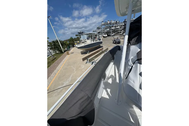 Slide: The Image of 2021 Glasstream 280 Pro-XS boat docked under clear blue sky. - 11