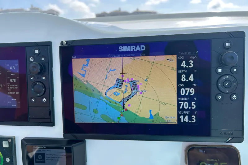Slide: The Image of Simrad navigation display on 2021 Glasstream 280 Pro-XS boat dashboard. - 16
