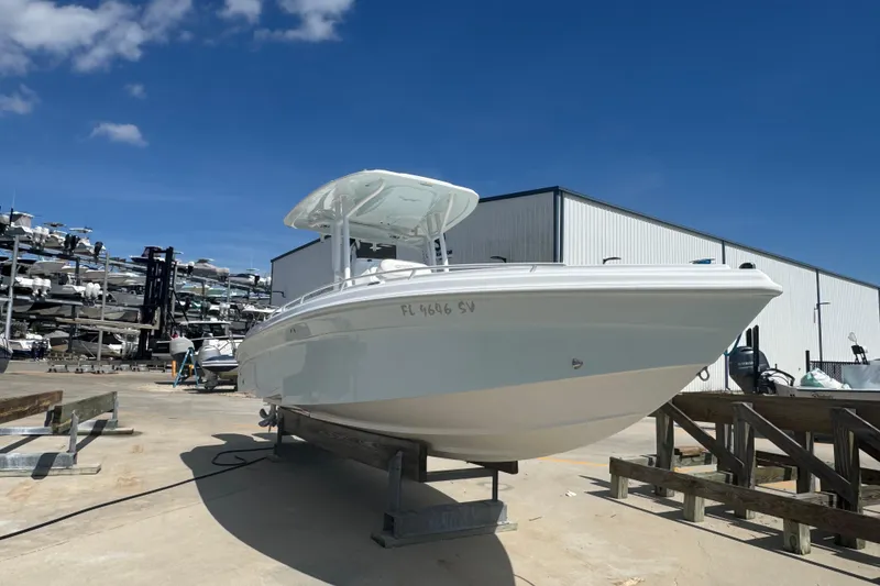 Slide: The Image of 2021 Glasstream 280 Pro-XS boat on dry dock under clear blue sky. - 3