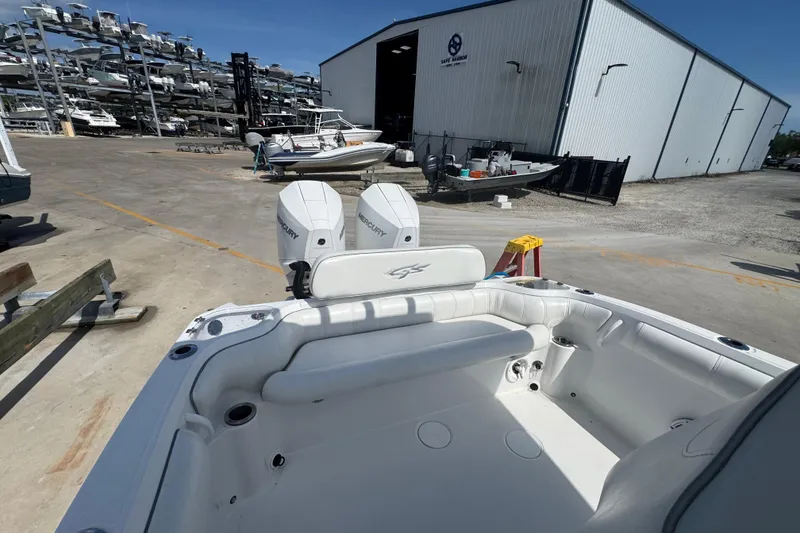 Slide: The Image of 2021 Glasstream 280 Pro-XS boat with dual Mercury engines at a marina. - 9