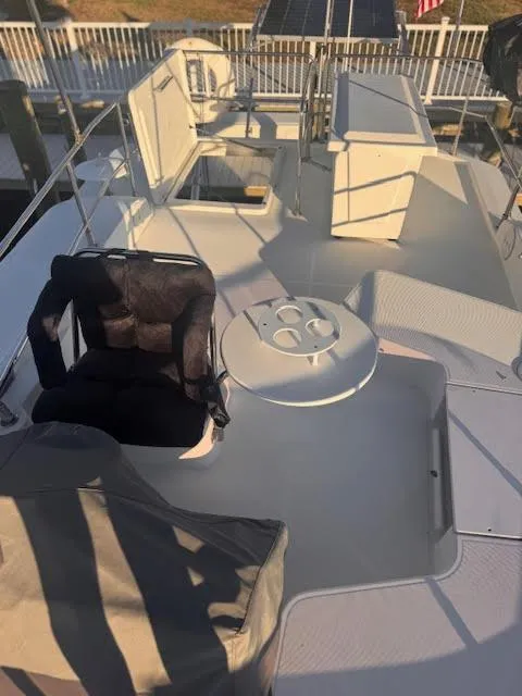 Slide: The Image of 2016 Beneteau Swift Trawler 30 flybridge with seating and helm station. - 15