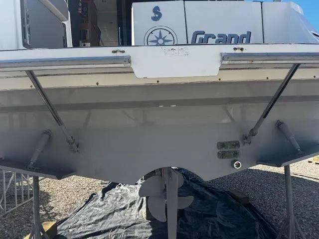 Slide: The Image of 2016 Beneteau Swift Trawler 30, rear view, showcasing propeller and hull details. - 22
