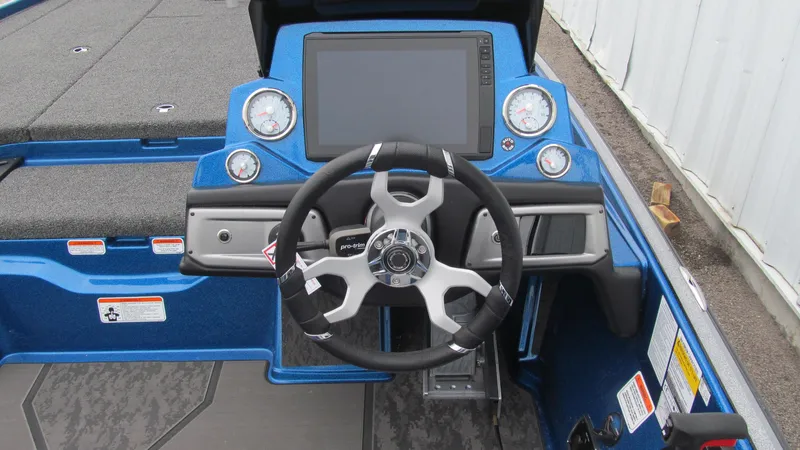Slide: The Image of 2025 Nitro Z20 XL Pro boat dashboard with steering wheel and digital display. - 5