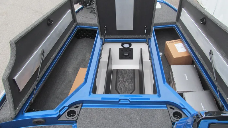 Slide: The Image of 2025 Nitro Z20 XL Pro boat storage compartments with boxes and equipment. - 7