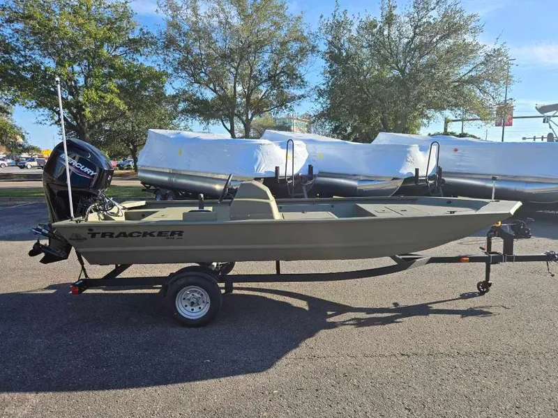 The Image of 2025 Tracker Grizzly 1648 SC boat on trailer, parked outdoors. - 0