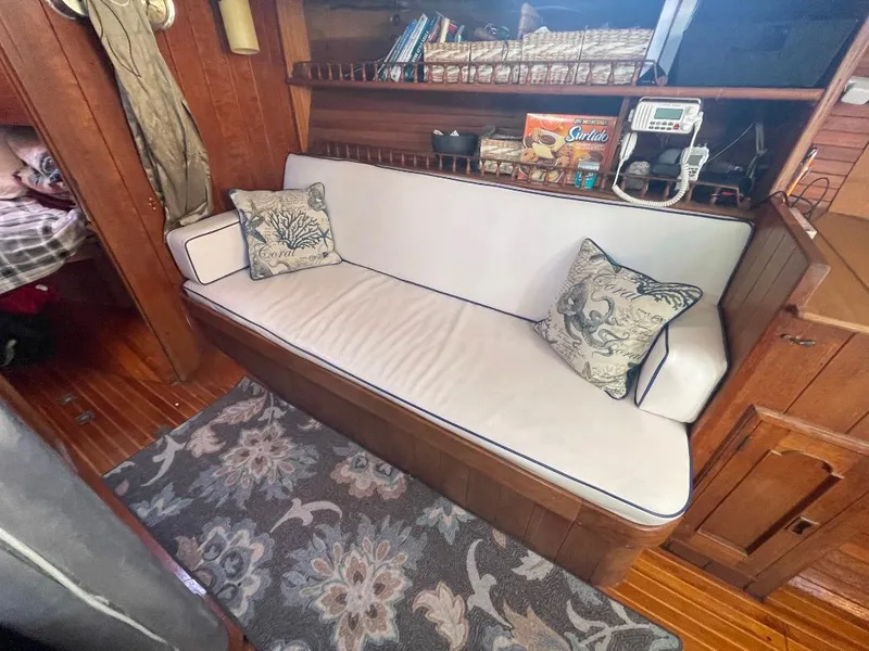 Slide: The Image of Interior of 1979 C & L Explorer Center Cockpit Cutter with cozy seating and nautical decor. - 14