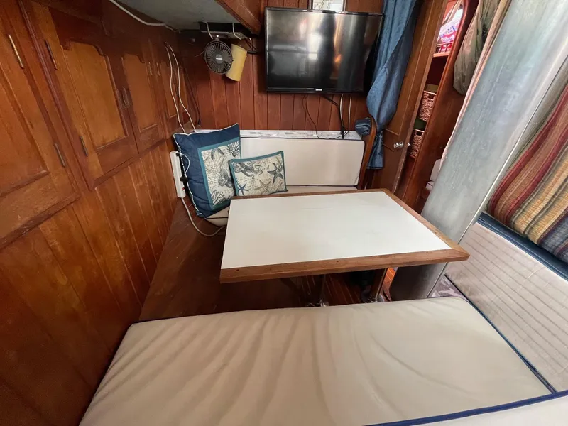 Slide: The Image of Interior of 1979 C & L Explorer Center Cockpit Cutter with cozy seating and table. - 15