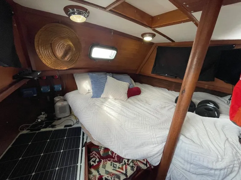 Slide: The Image of Cozy cabin interior of 1979 C & L Explorer Center Cockpit Cutter with bed and nautical decor. - 19