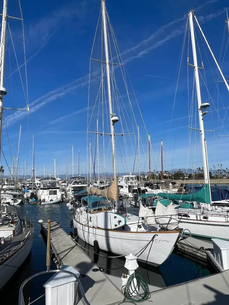 Slide: The Image of 1979 C & L Explorer Center Cockpit Cutter docked in a marina under clear blue skies. - 22