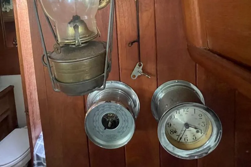 Slide: The Image of Vintage nautical instruments and lantern on 1979 C & L Explorer Center Cockpit Cutter. - 28