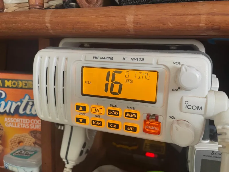 Slide: The Image of VHF marine radio IC-M412 displaying channel 16 on a 1979 C & L Explorer Center Cockpit Cutter. - 34