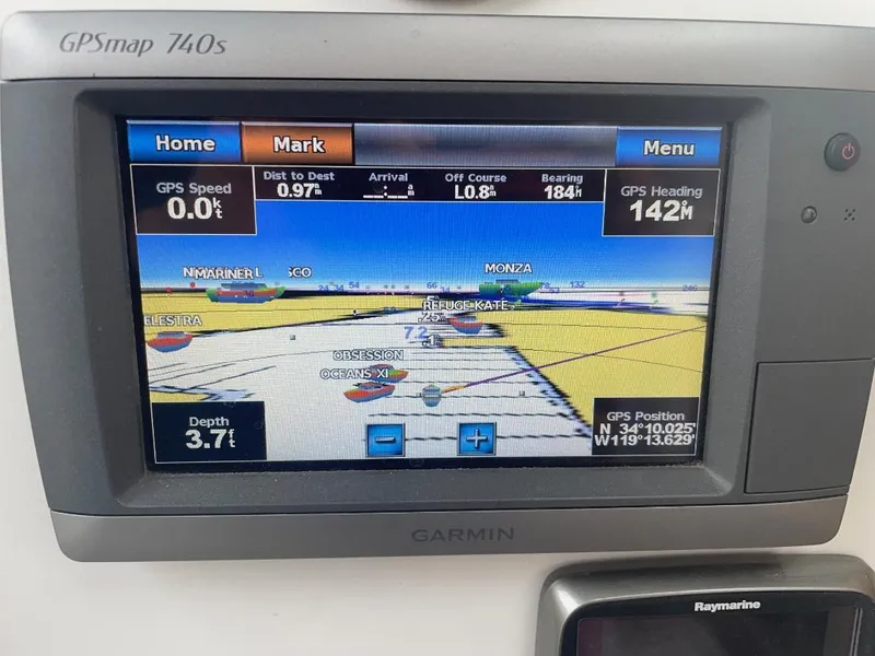 Slide: The Image of Garmin GPSmap 740s displaying navigation data on a 1979 C & L Explorer Center Cockpit Cutter. - 36