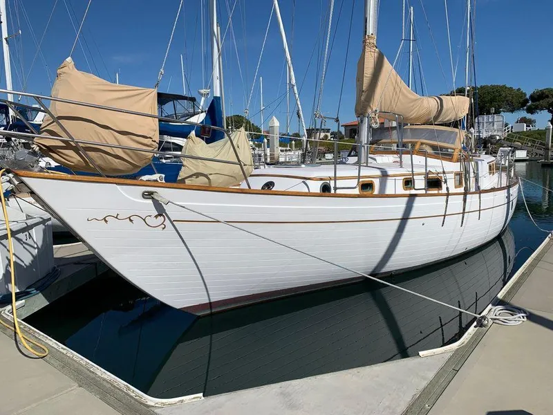Slide: The Image of 1979 C & L Explorer Center Cockpit Cutter sailboat docked in marina. - 6