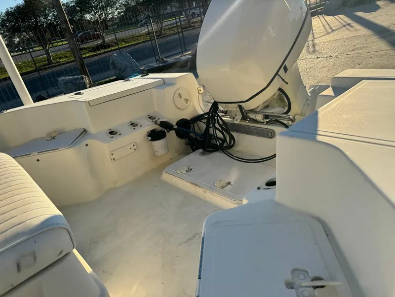 Slide: The Image of 2004 Sea Boss 190 Center Console boat interior with outboard motor. - 14