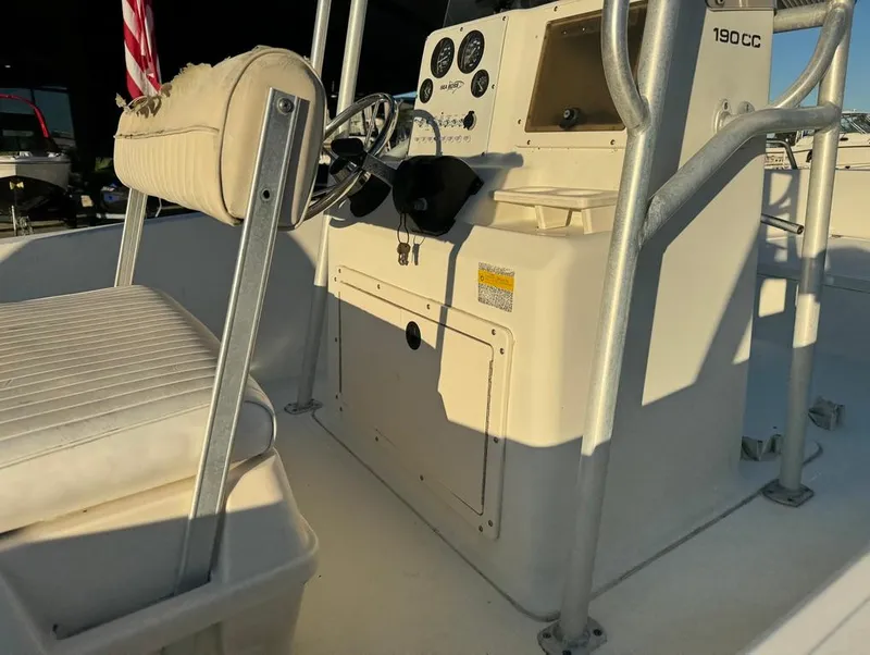 Slide: The Image of 2004 Sea Boss 190 Center Console boat interior with steering wheel and seating. - 16