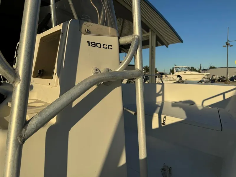 Slide: The Image of 2004 Sea Boss 190 Center Console boat, close-up view of helm and railing. - 17