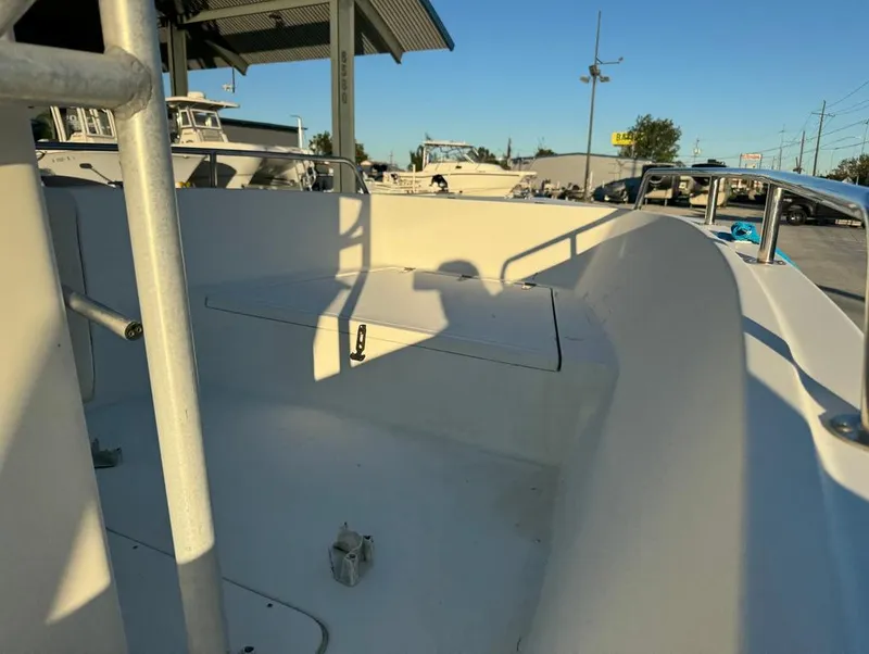 Slide: The Image of 2004 Sea Boss 190 Center Console boat interior, showcasing seating and storage area. - 18