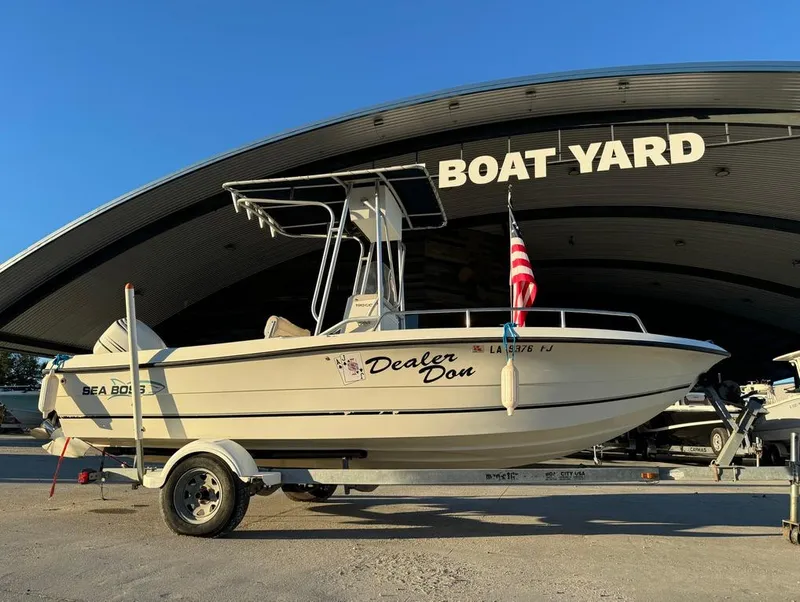Slide: The Image of 2004 Sea Boss 190 Center Console boat on trailer at boat yard. - 2