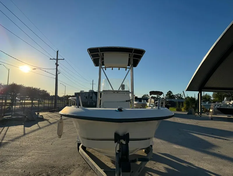 Slide: The Image of 2004 Sea Boss 190 Center Console boat in sunny outdoor setting. - 4