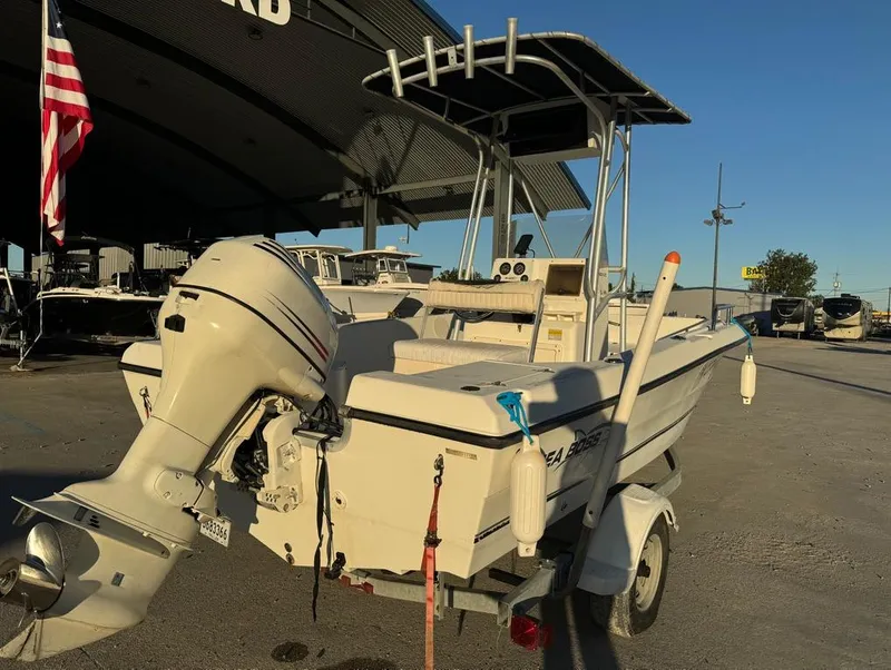 Slide: The Image of 2004 Sea Boss 190 Center Console boat on trailer, parked outdoors. - 6