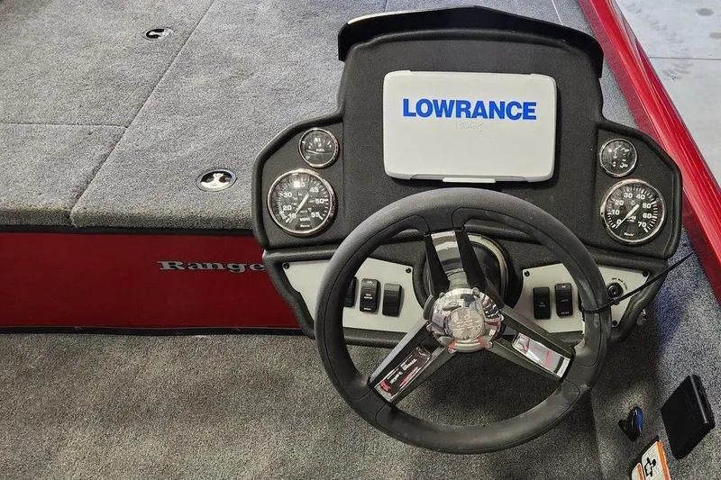 Slide: The Image of 2025 Ranger RT188 boat dashboard with Lowrance display and steering wheel. - 4
