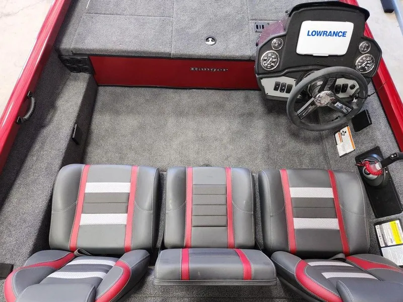 Slide: The Image of 2025 Ranger RT188 boat interior with gray and red seating, Lowrance dashboard. - 6