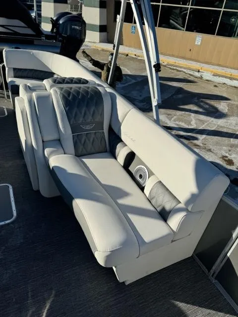 Slide: The Image of 2024 Bennington 25 QFB boat with luxurious seating and modern design. - 18