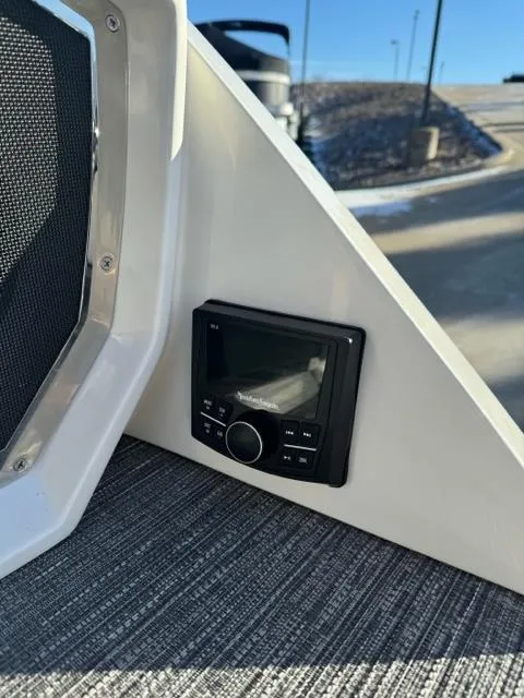 Slide: The Image of 2024 Bennington 25 QFB boat interior with audio control panel. - 7