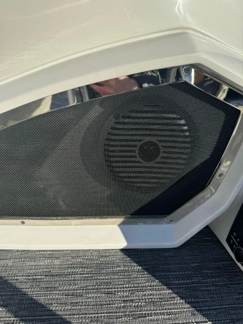 Slide: The Image of 2024 Bennington 25 QFB boat speaker detail with sleek design. - 9